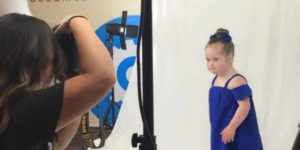 girl with Down Syndrome dressed up for photo shoot