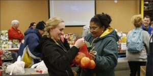 two women bonding with fruit