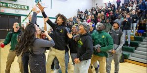 group of students yelling happily in the gym