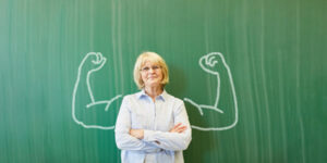 teacher with cartoon buff arms